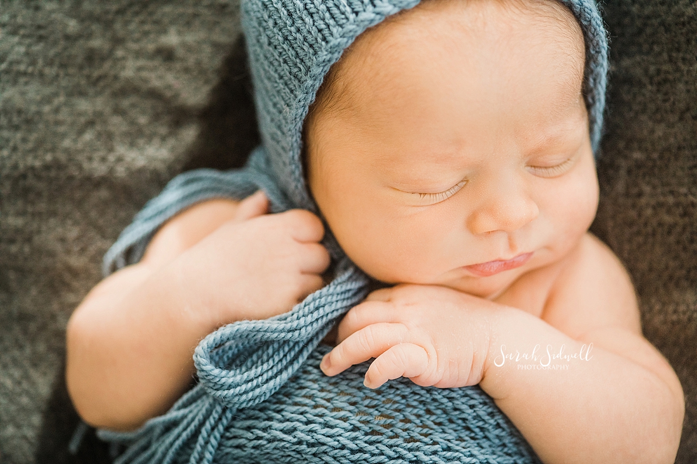 A newborn boy sleeps  | Sarah Sidwell Photography | Newborn Love