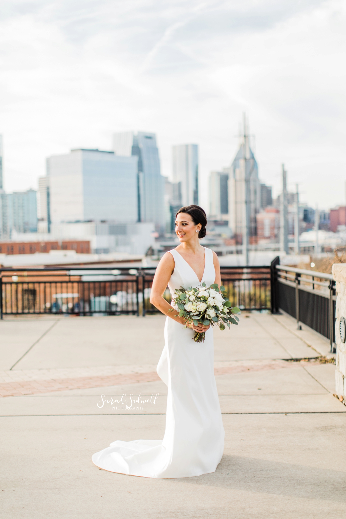 A bride stands on a rooftop | Sarah Sidwell Photography | The Bell Tower