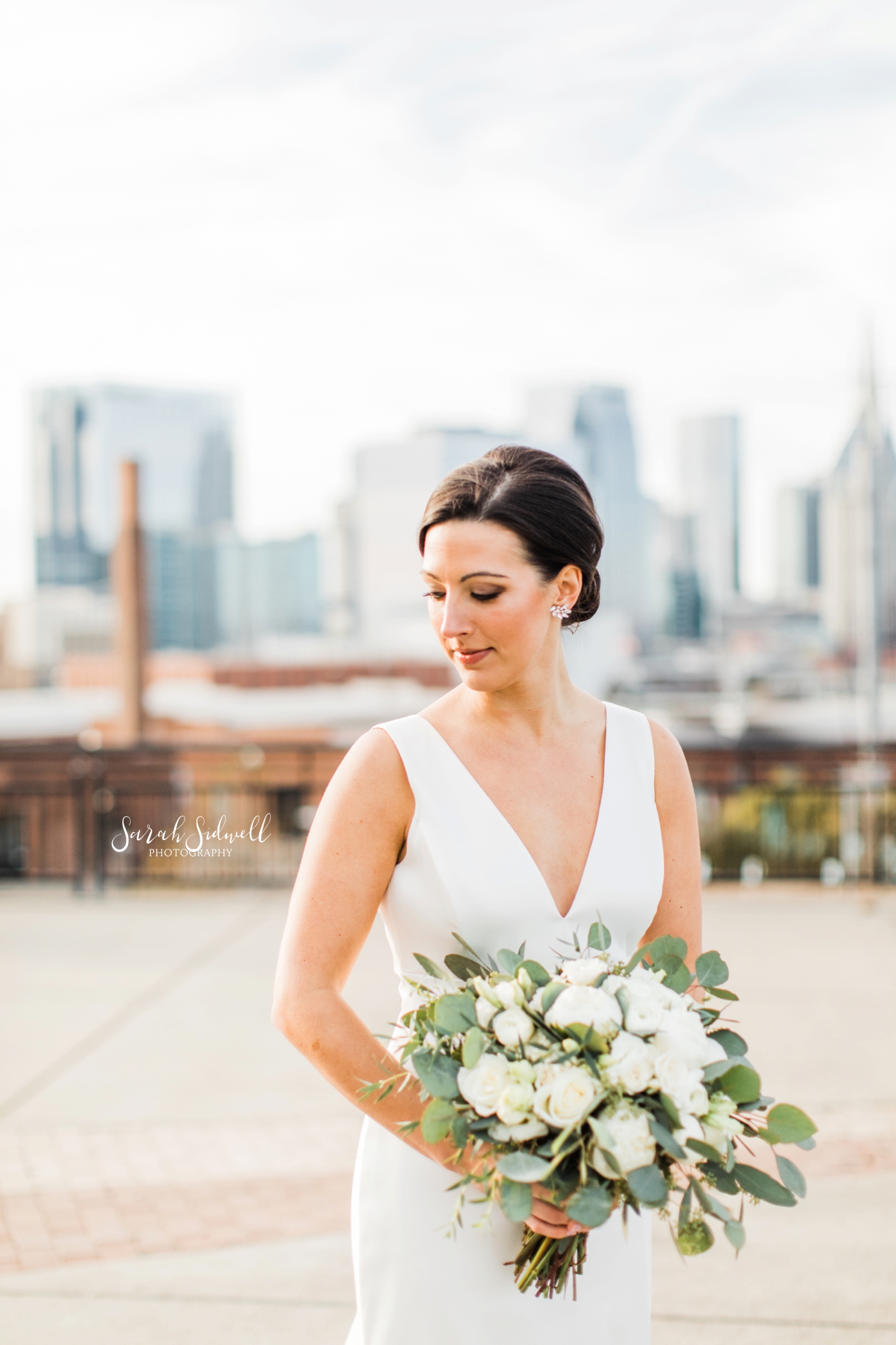 A bride glances over her shoulder | Sarah Sidwell Photography | The Bell Tower