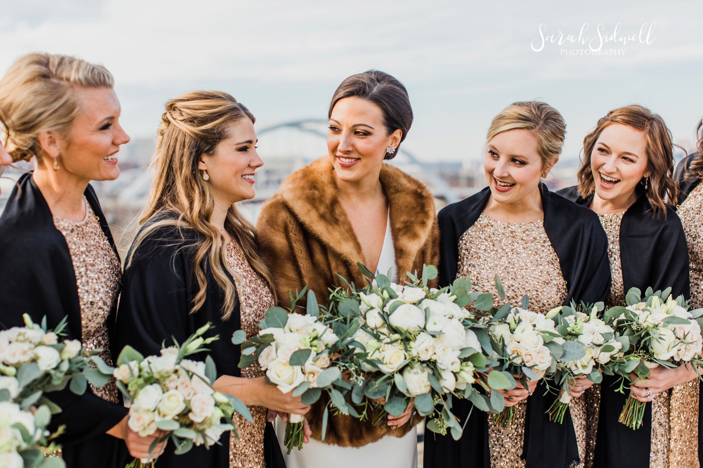 A bride wears a fur coat | Sarah Sidwell Photography | The Bell Tower