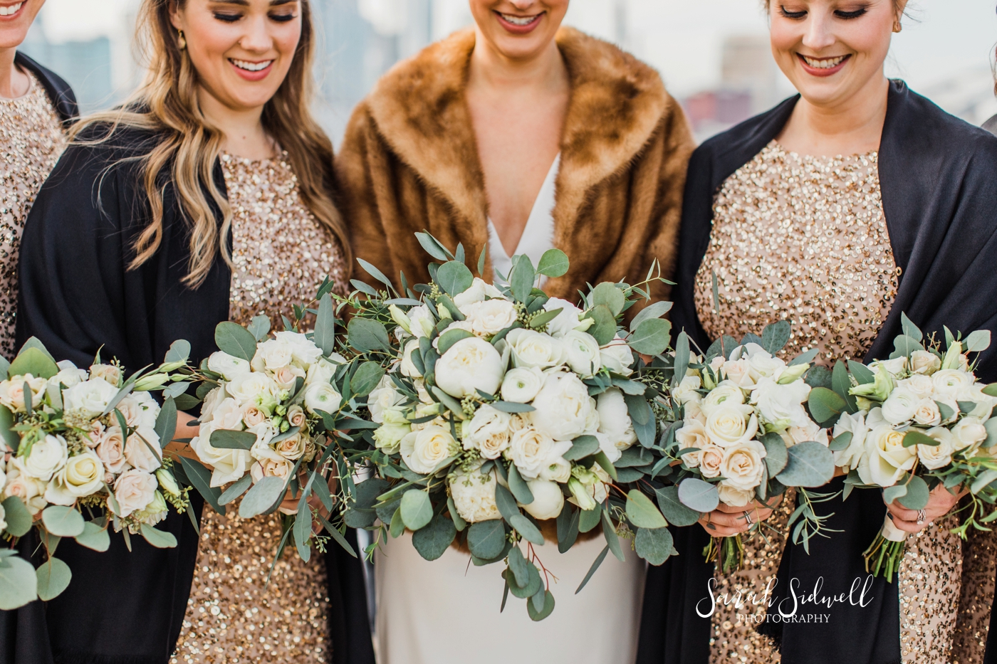 A bridal party show off their bouquets | Sarah Sidwell Photography | The Bell Tower