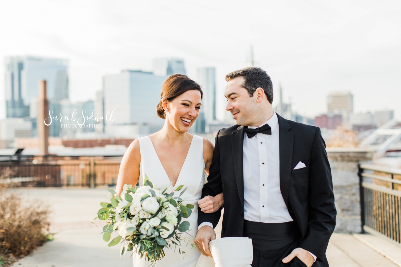 A man whispers to his new bride | Sarah Sidwell Photography | The Bell Tower