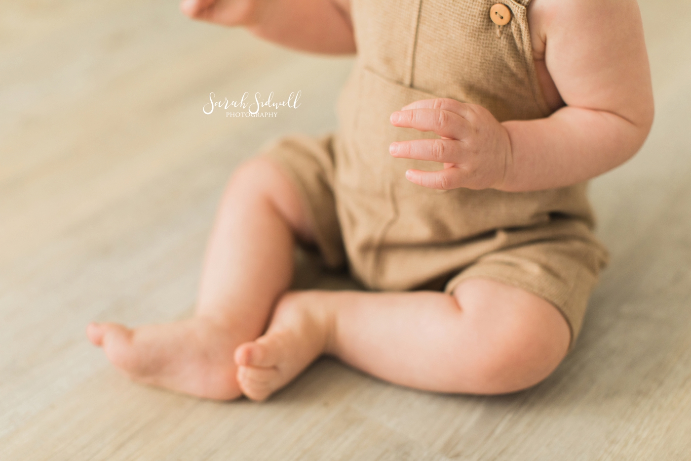 A baby crosses his legs | Sarah Sidwell Photography