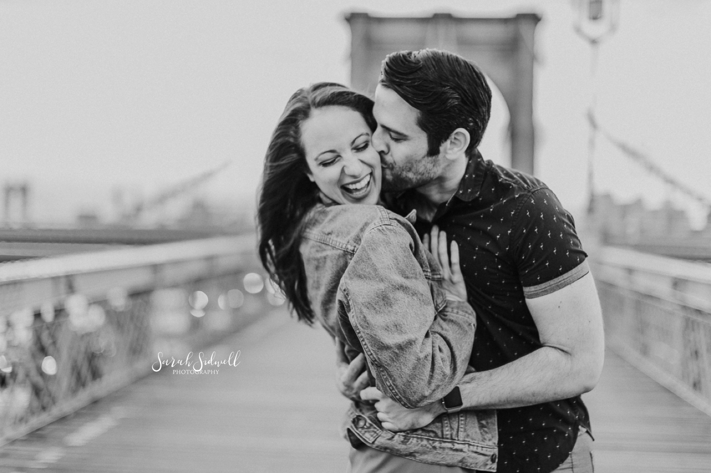 A man kisses his fiance.  | Sarah Sidwell Photography | Nashville Engagement Photographer