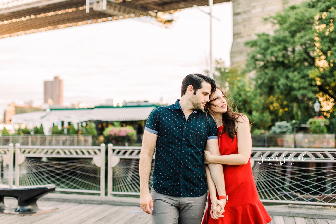 A woman holds onto her fiance.  | Sarah Sidwell Photography | Nashville Engagement Photographer