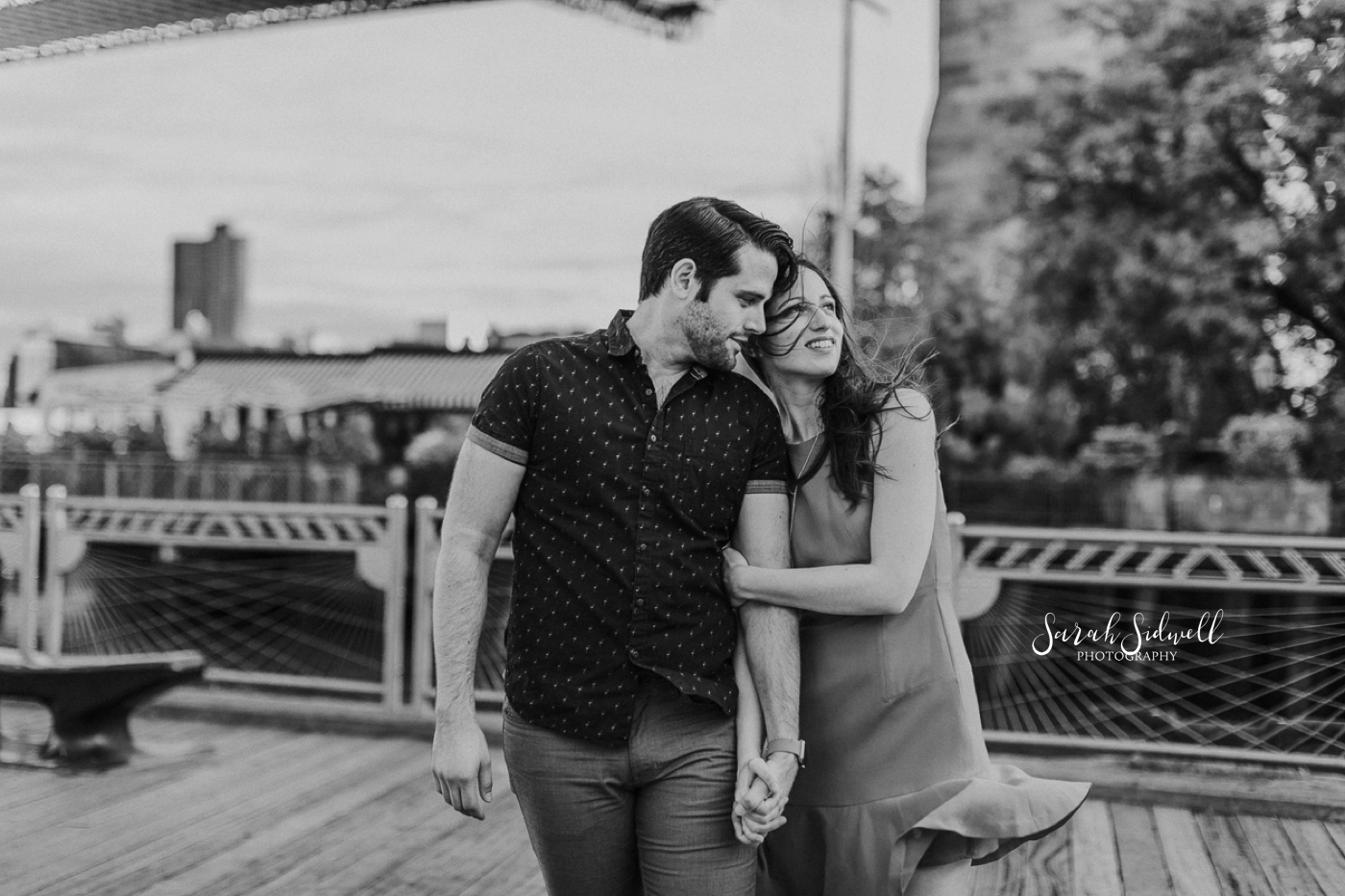 A man leans in to his fiance.  | Sarah Sidwell Photography | Nashville Engagement Photographer
