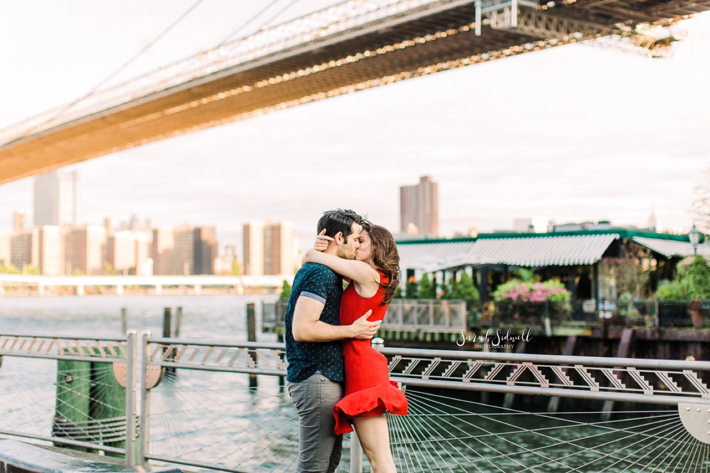 A woman's dress flies up as she kisses her fiance.  | Sarah Sidwell Photography | Nashville Engagement Photographer
