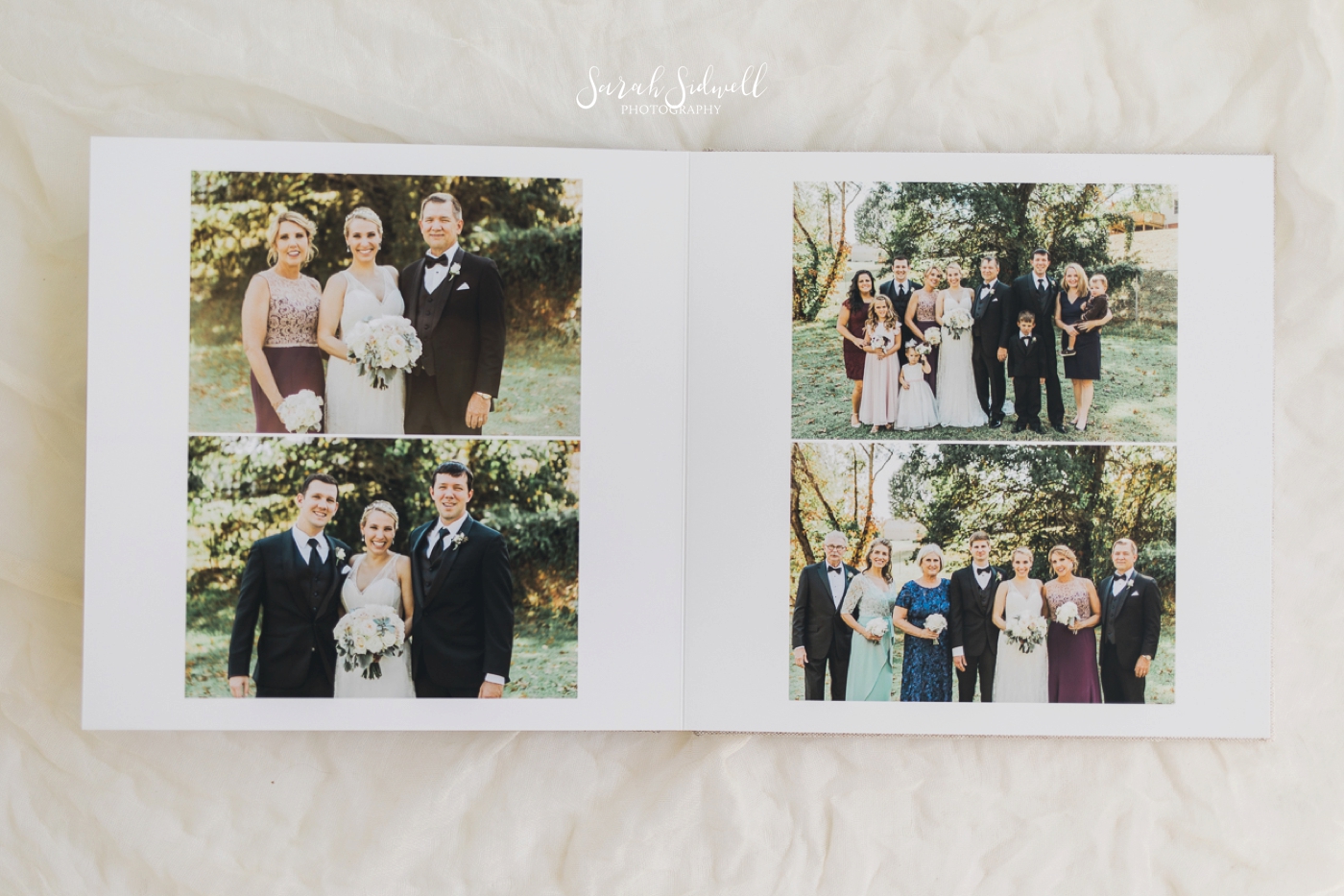 A photographer lays out a wedding album for review. 