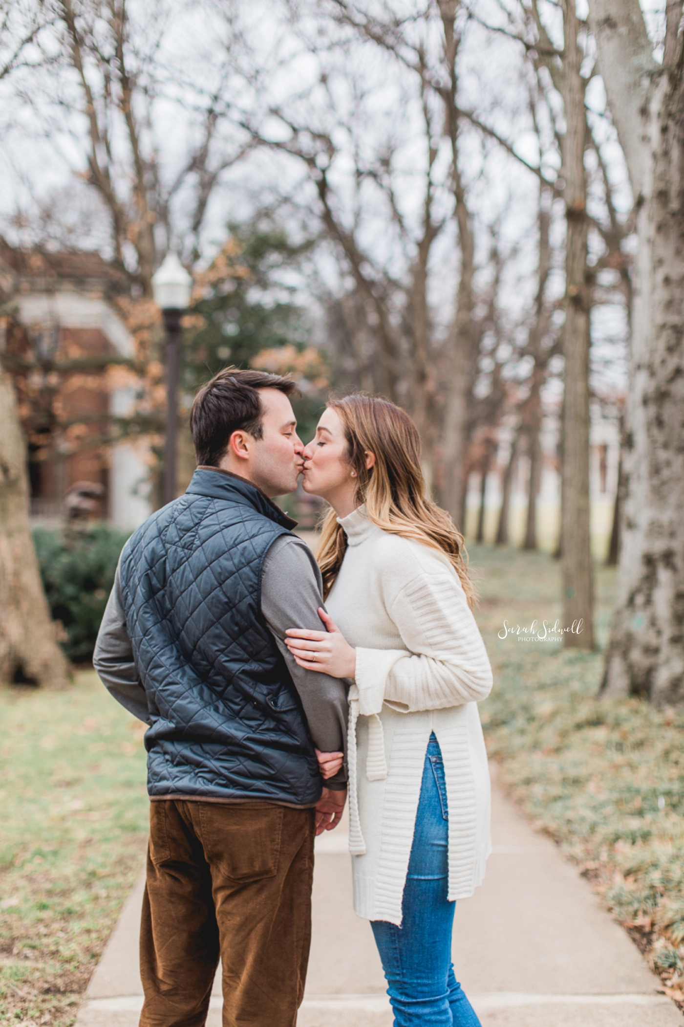 A Nashville engagement photographer captures a man stealing a kiss. 