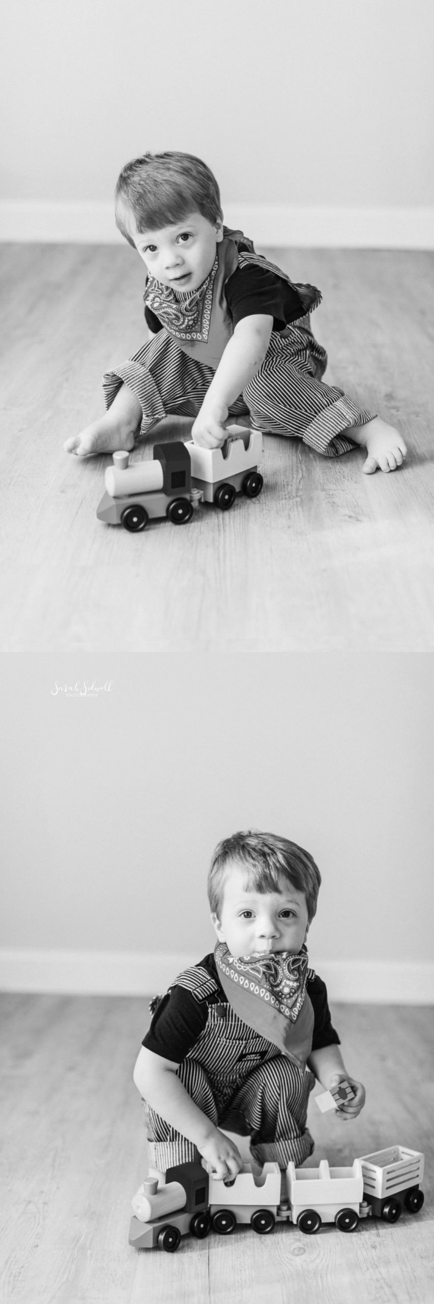 A boy plays with his trains. 