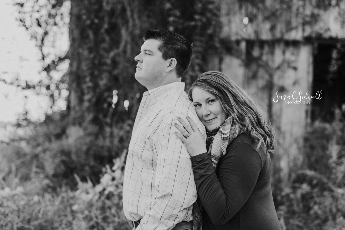 A woman hugs her fiance from behind | Nashville Engagement Photography