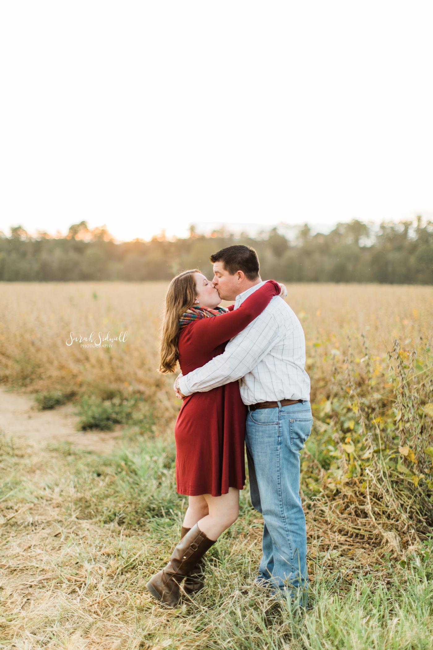 An engaged couple kisses each other. | Nashville Engagement Photography