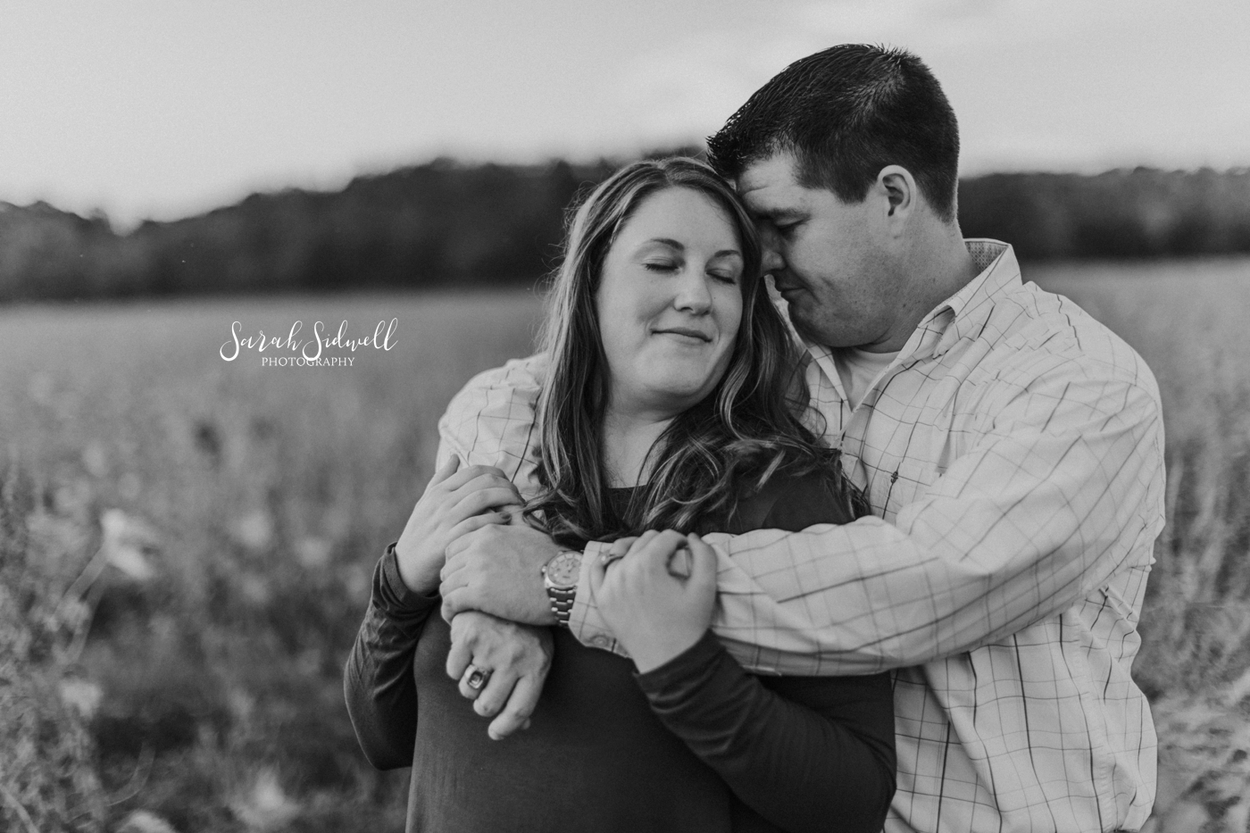 A man leans in close to his fiance. | Nashville Engagement Photography