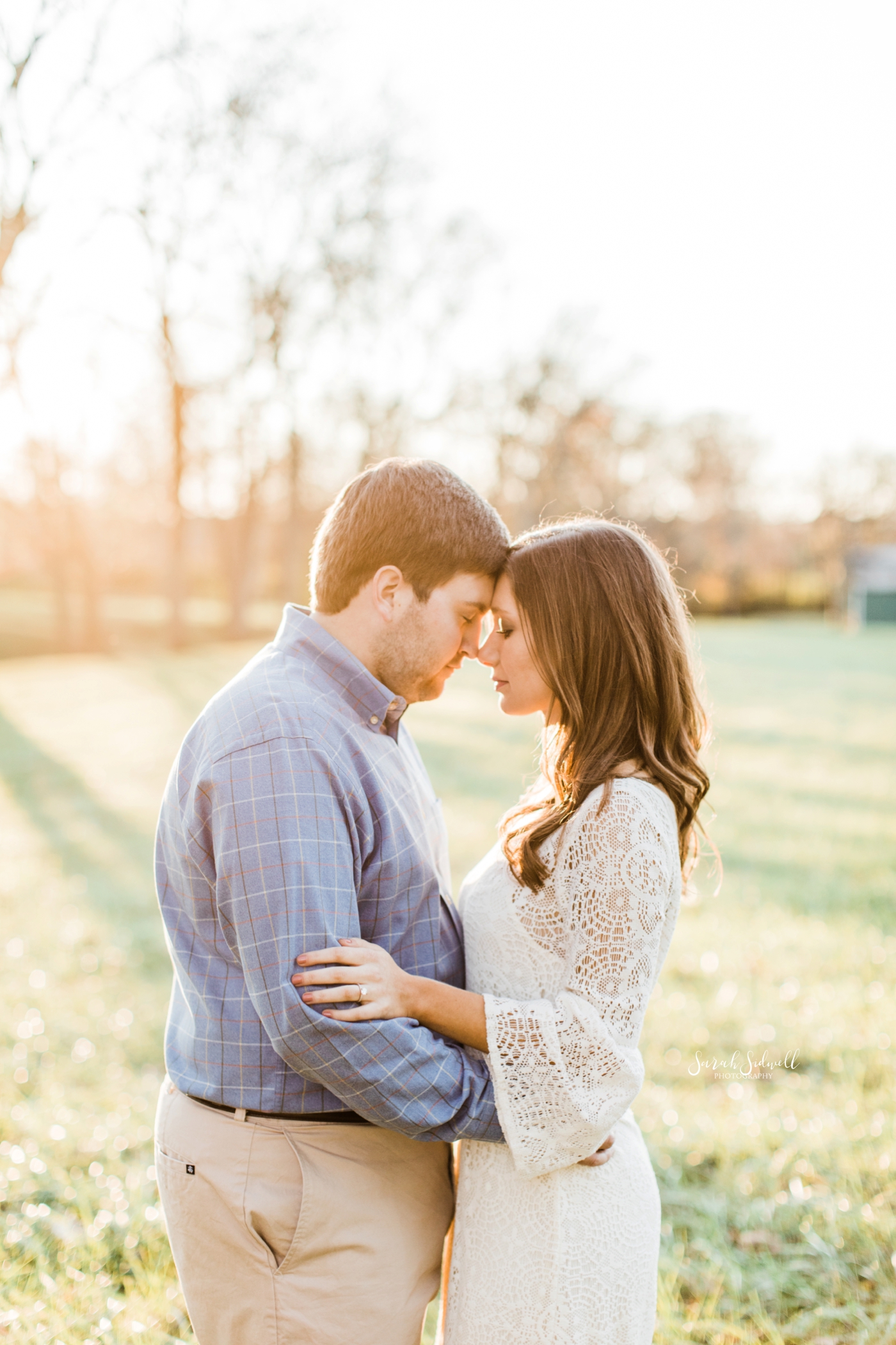 A couple stand very close to one another | Engagement Photography Nashville