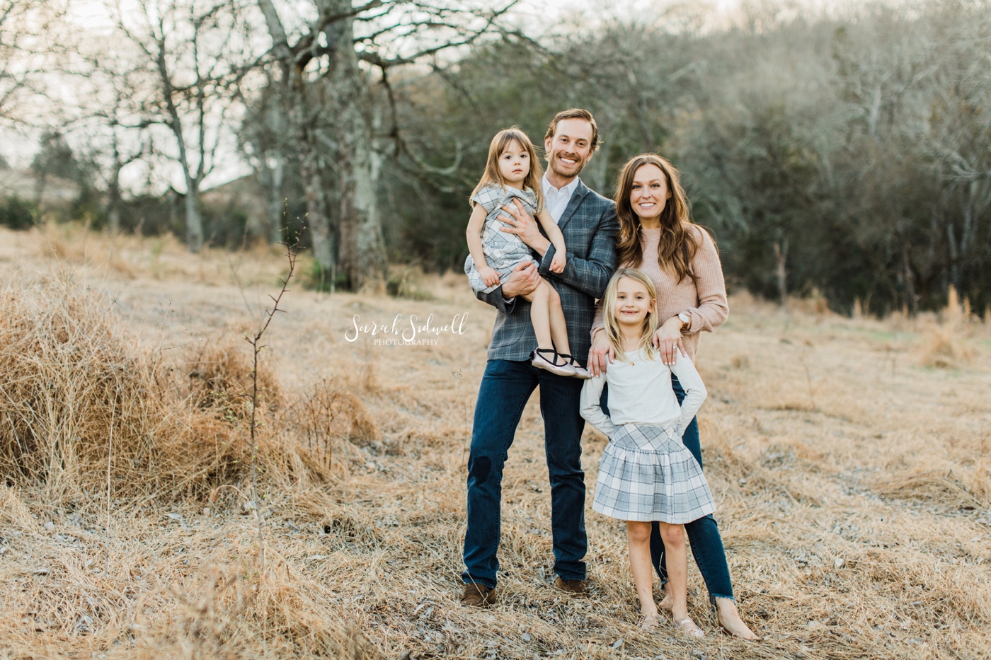 A family stands in a field | Nashville Family Photos