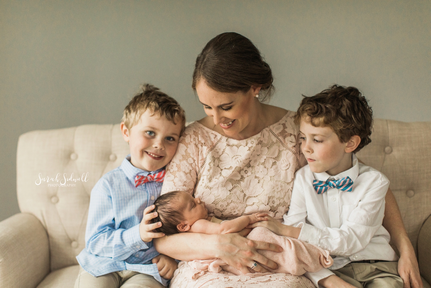 A mother sits with her children | Nashville Newborn Photographer