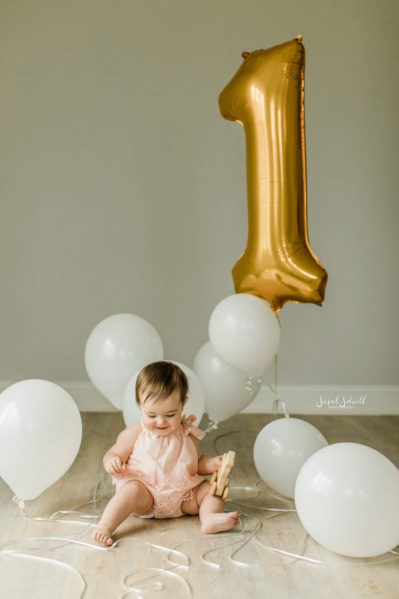 A baby plays with balloons | Nashville Baby Photographer 