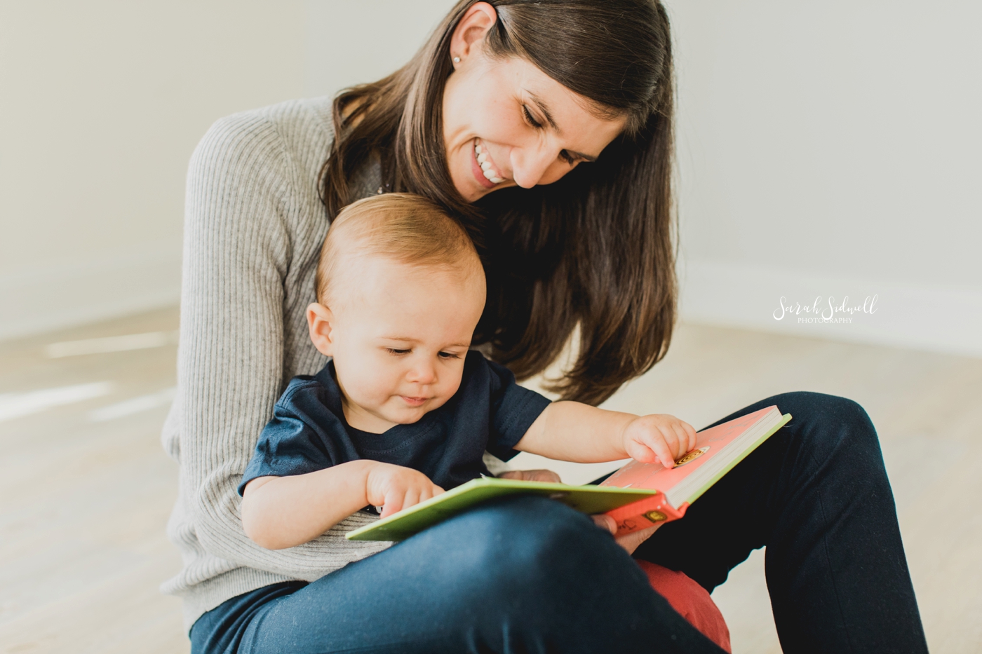 A mother reads to her baby. | Baby photography in Nashville. 