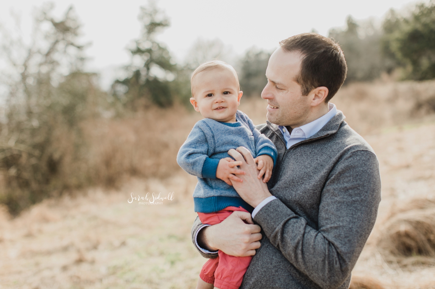 A man is holding his young son. | Baby Photography in Nashville. 