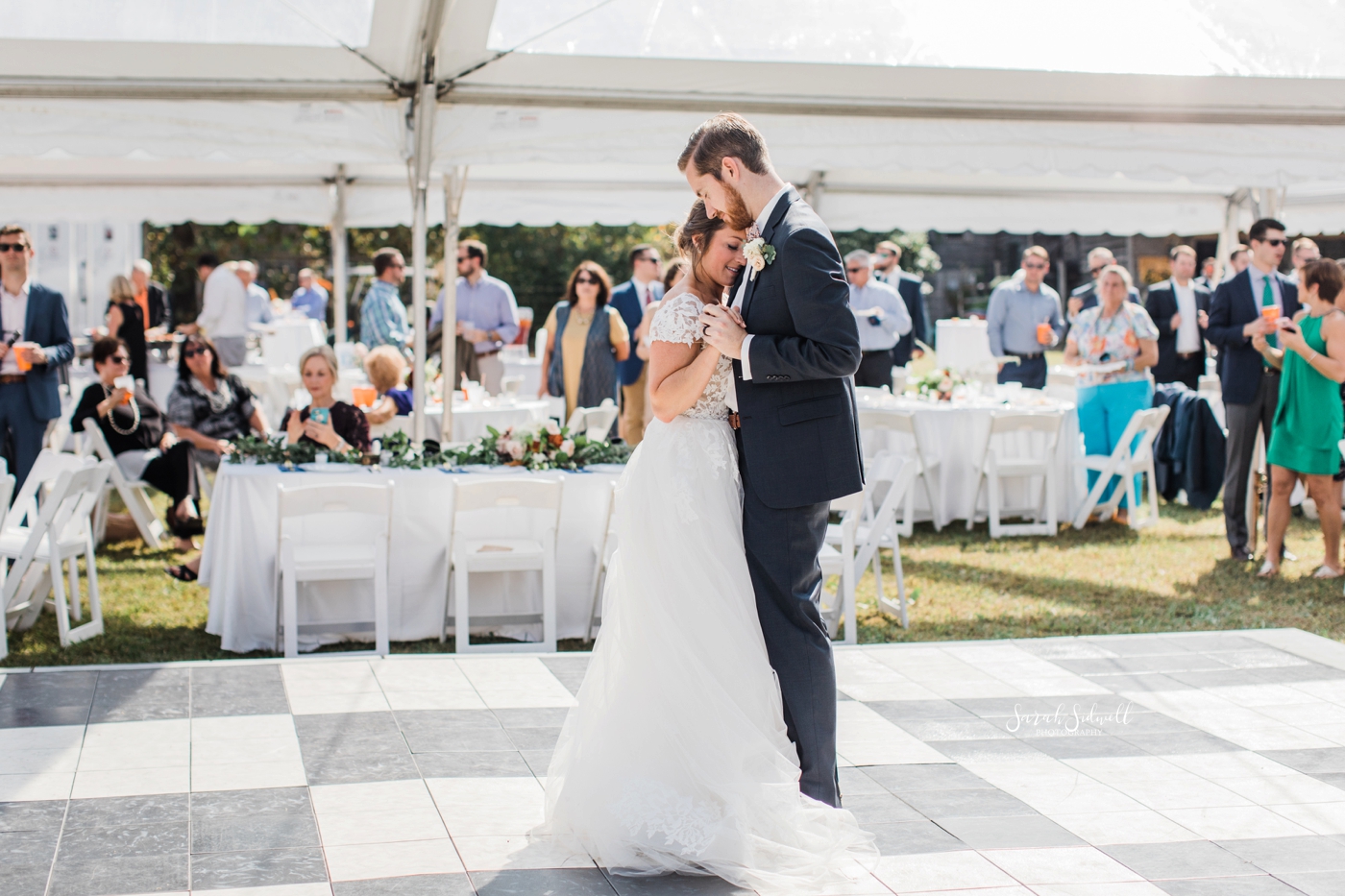 A bride and groom share their first dance. 