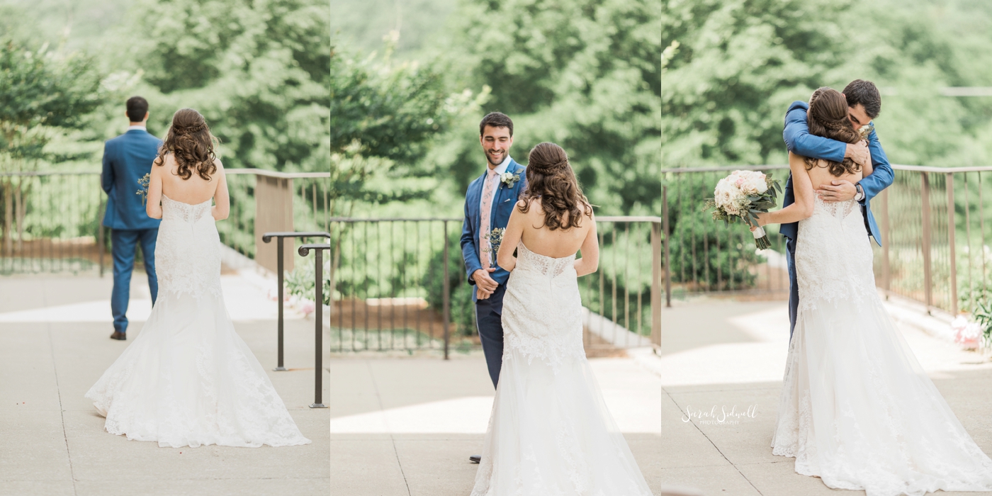 A bride takes a walk with her groom outdoors. 