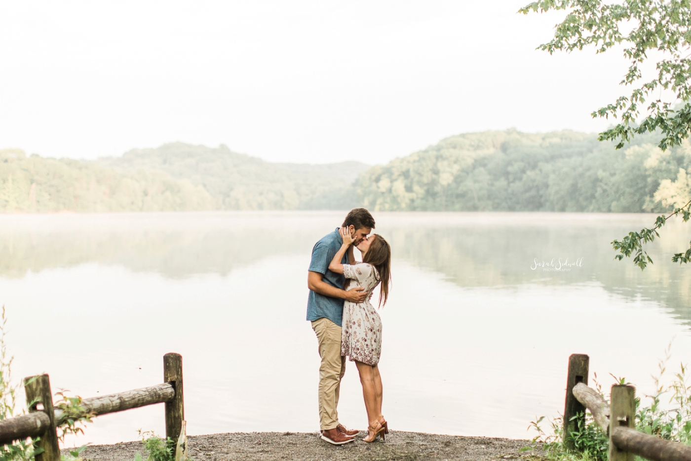 During their Radnor Lake engagement photographs, a couple kisses. 