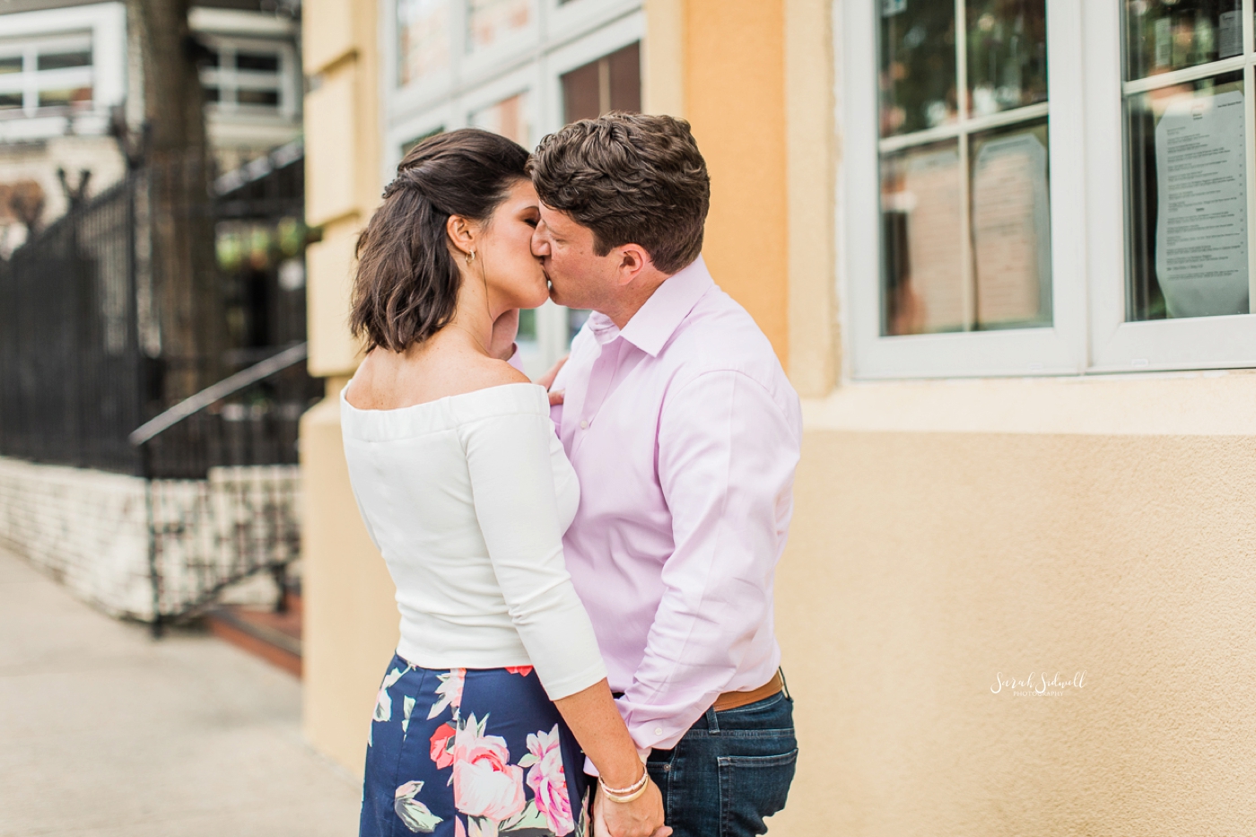 A couple share an intimate kiss during their engagement pictures. 