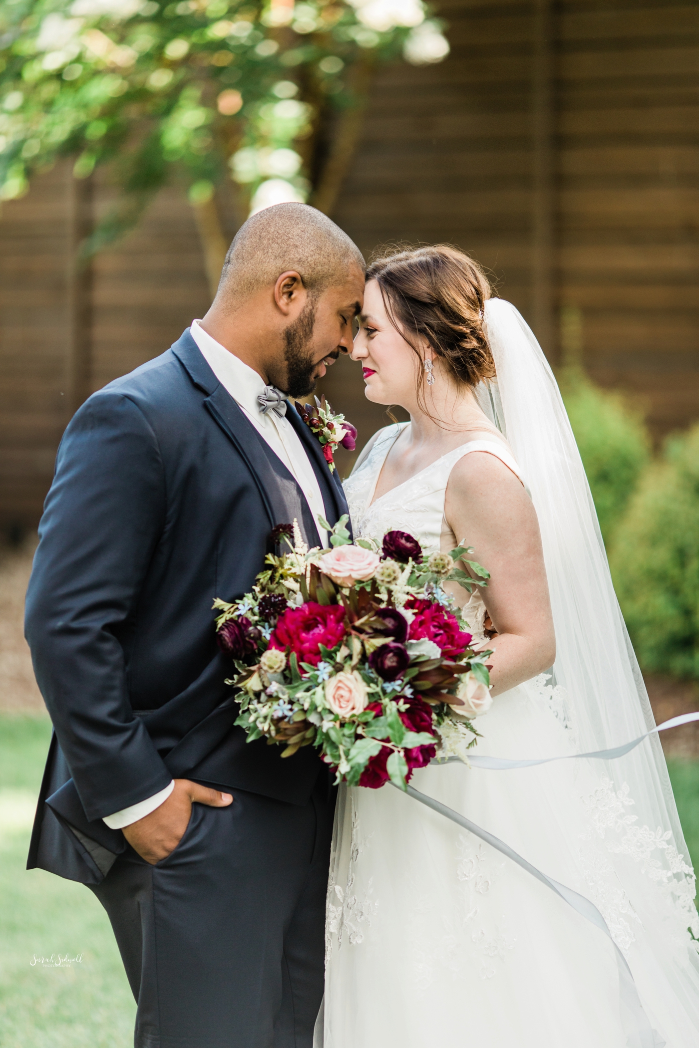 A couple share a sweet moment before their Cordelle wedding. 