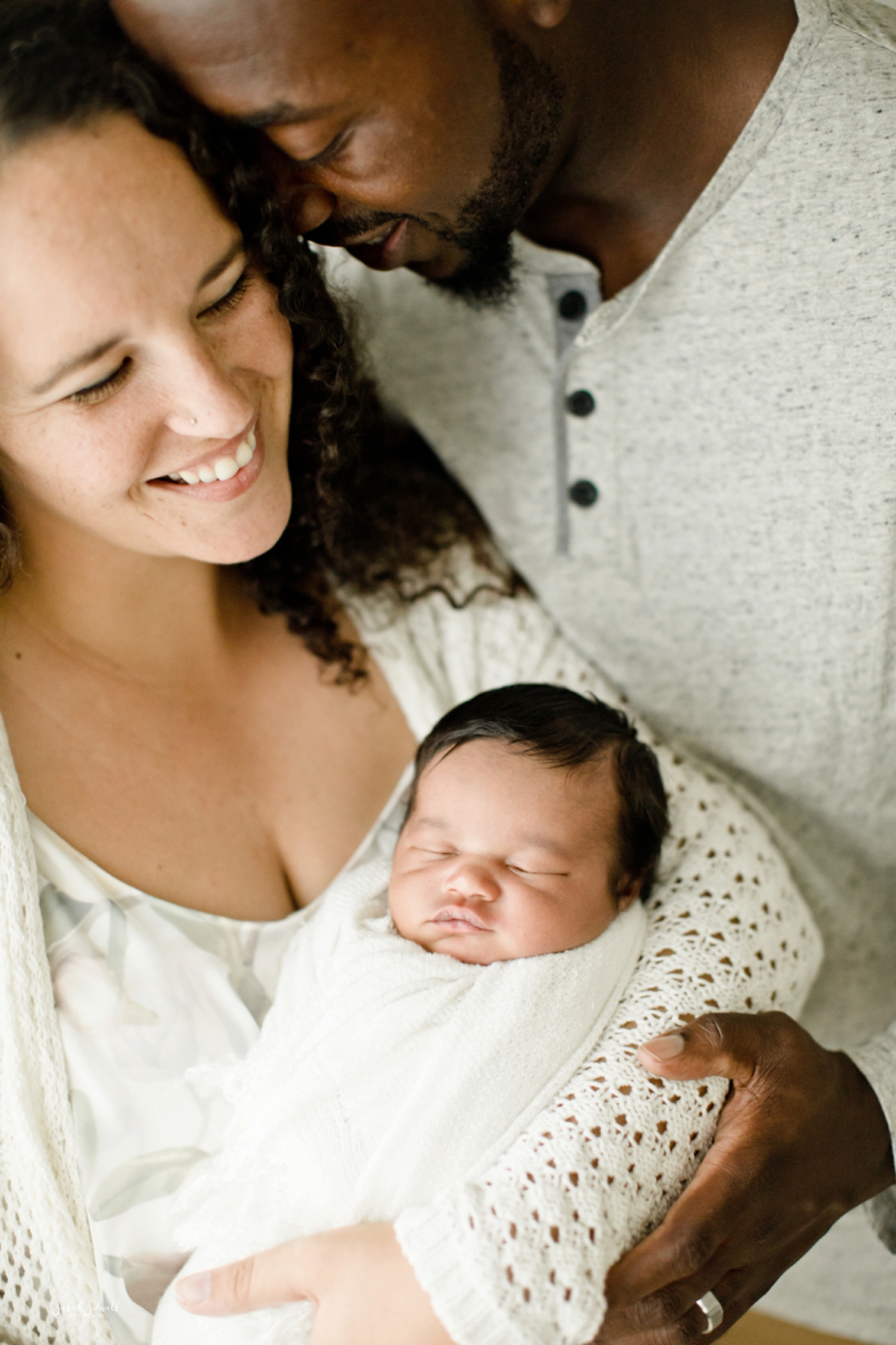 A mother holds her baby for some Nashville newborn pictures. 