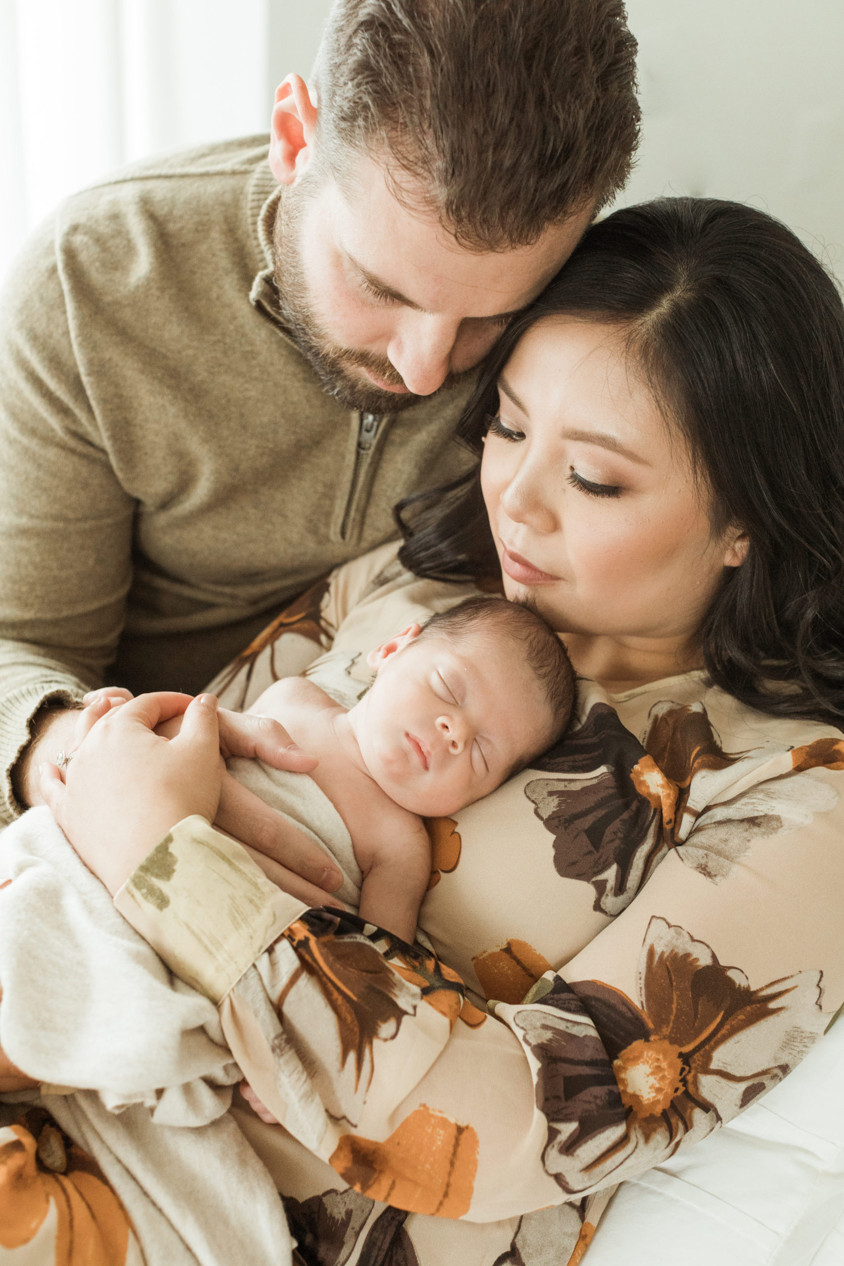 family of three. mom, dad and newborn son. newborn photography