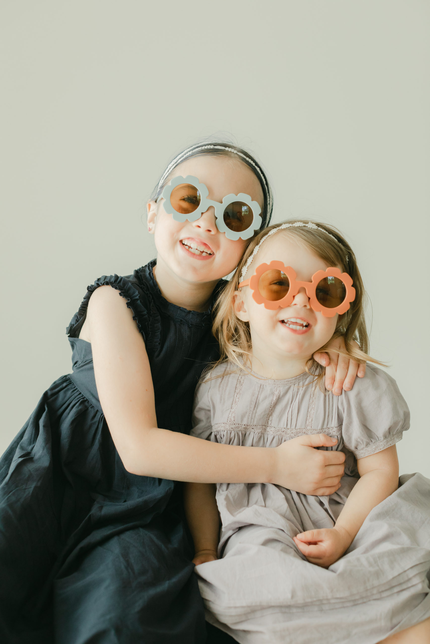 two sisters in fun sunglasses 