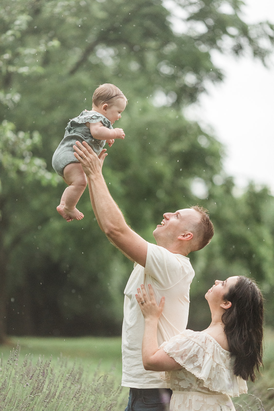 outdoor family photo of three. raining photoshoot in nashville tennessee