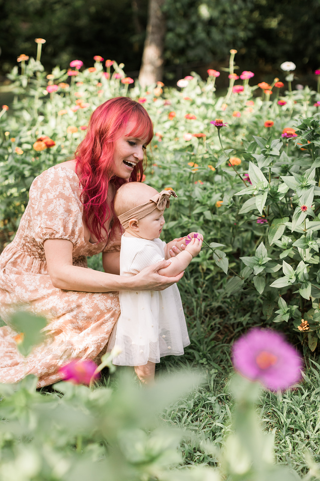 Nashville baby photographer. Mama and baby girl in garden.