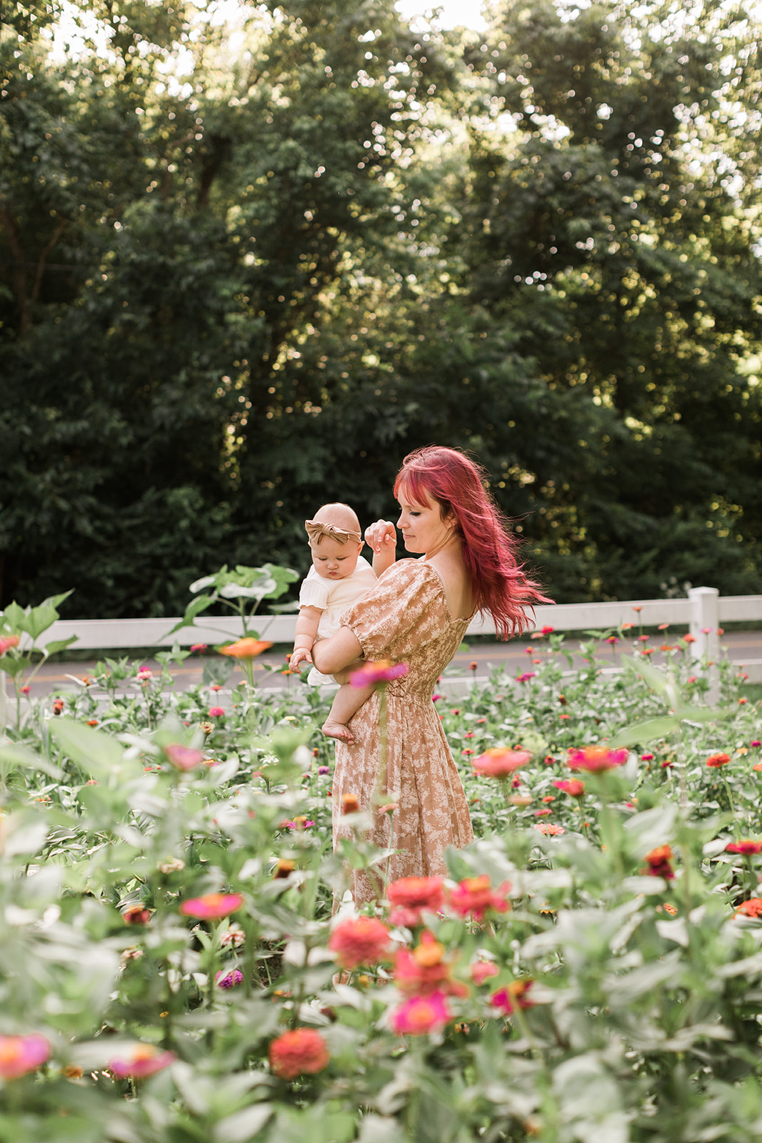 Nashville baby photographer. Mama and baby girl in garden.