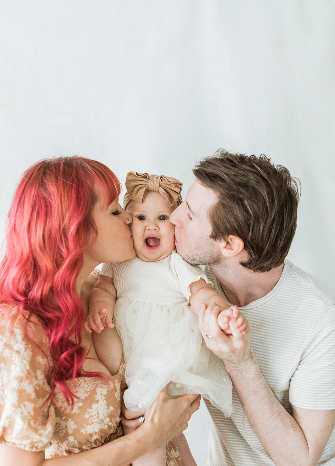 Nashville baby photographer. Family of three, dad, mom and baby girl.