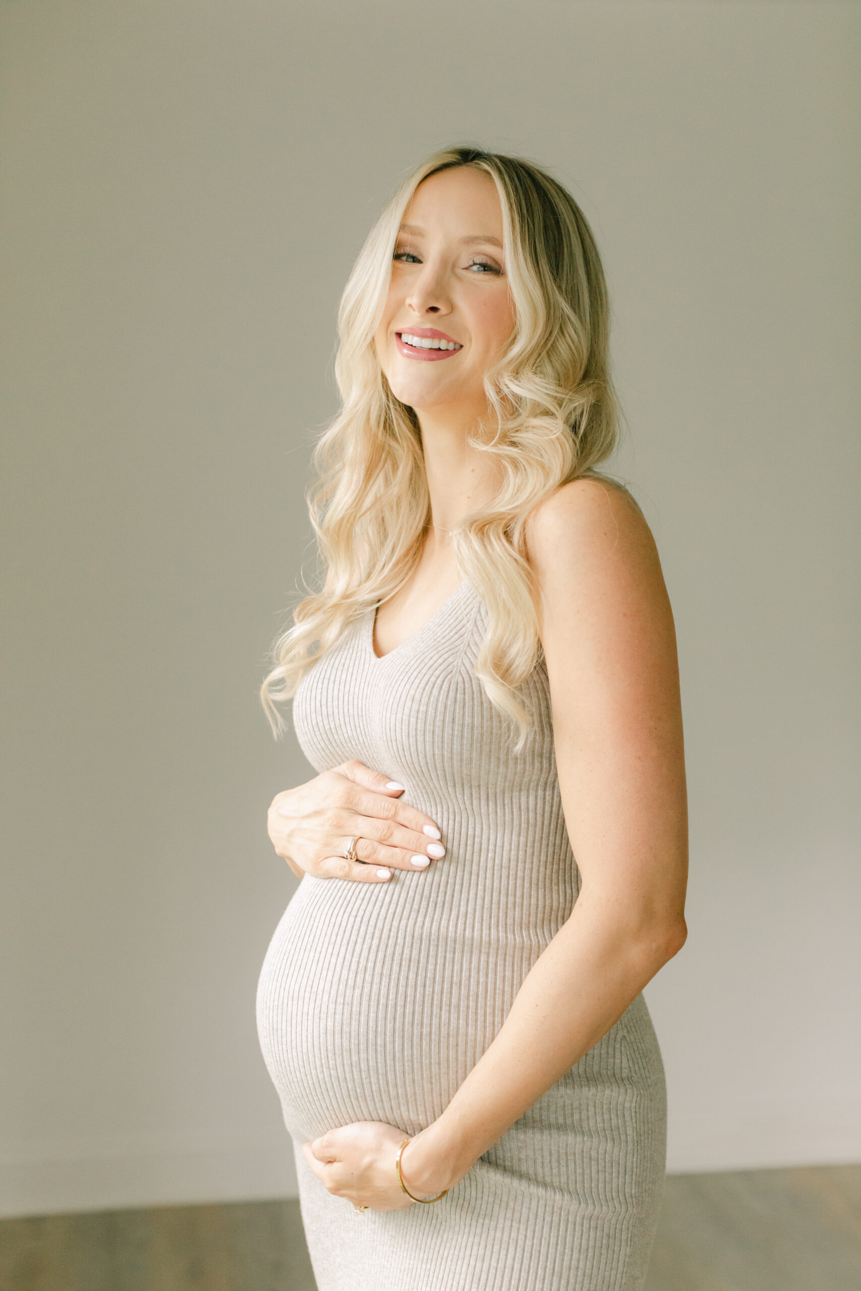 Maternity studio session in Nashville TN. Smiling mama to be