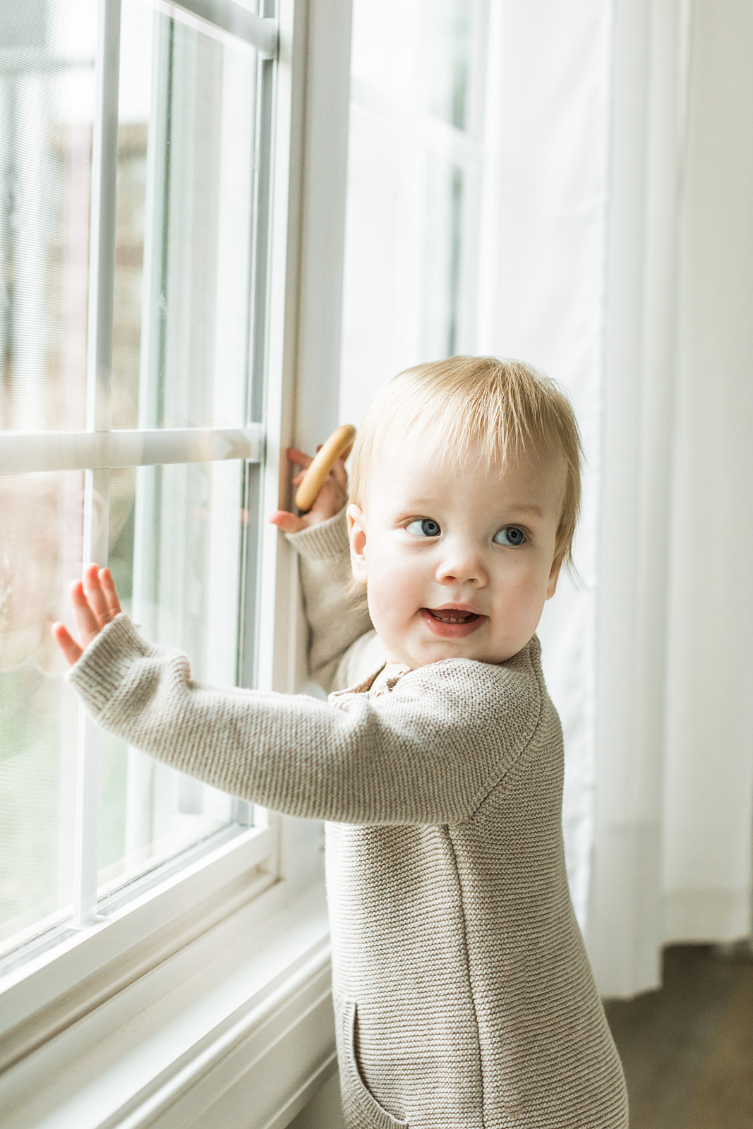 1 year old photo shoot in nashville tennessee. baby boy looking out window