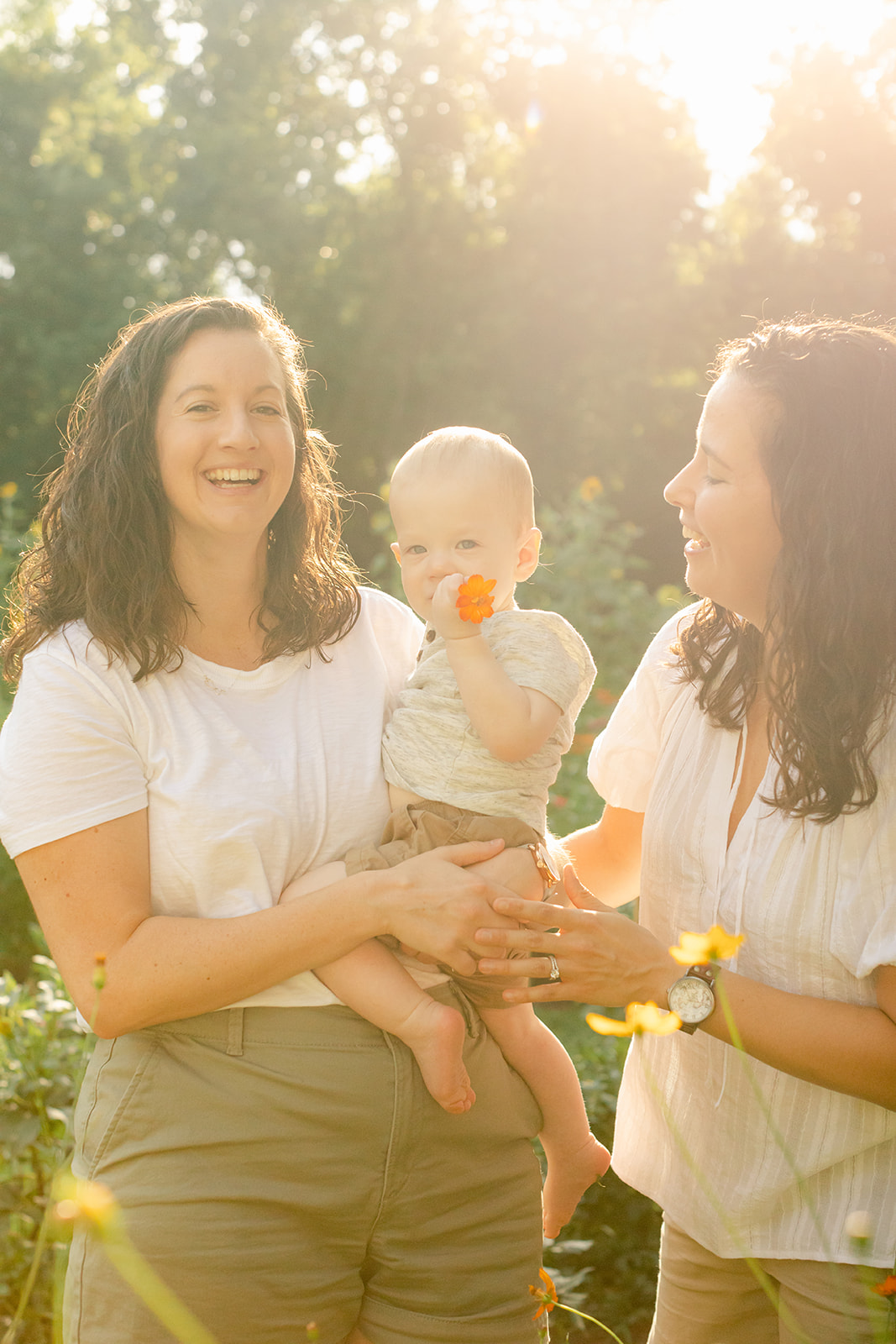 outdoor motherhood minis in garden. photographed in nashville photographer. two moms with baby boy
