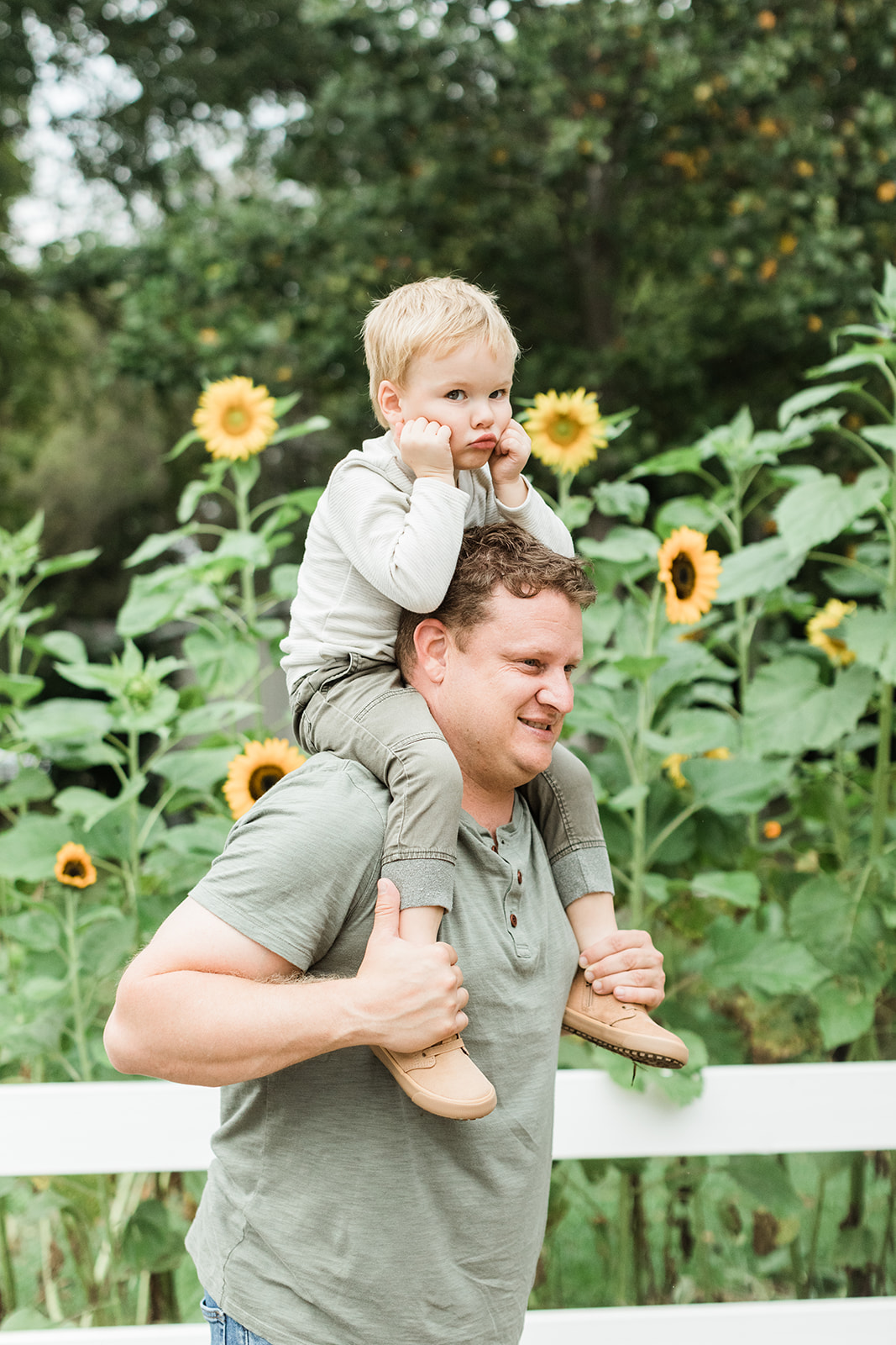outdoor family session in nashville tennessee. little boy on dad's shoulder