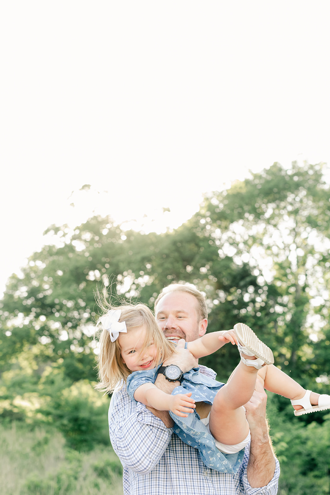outdoor family photos for 2 year baby milestone session in nashville tennessee. photo of dad and daughter