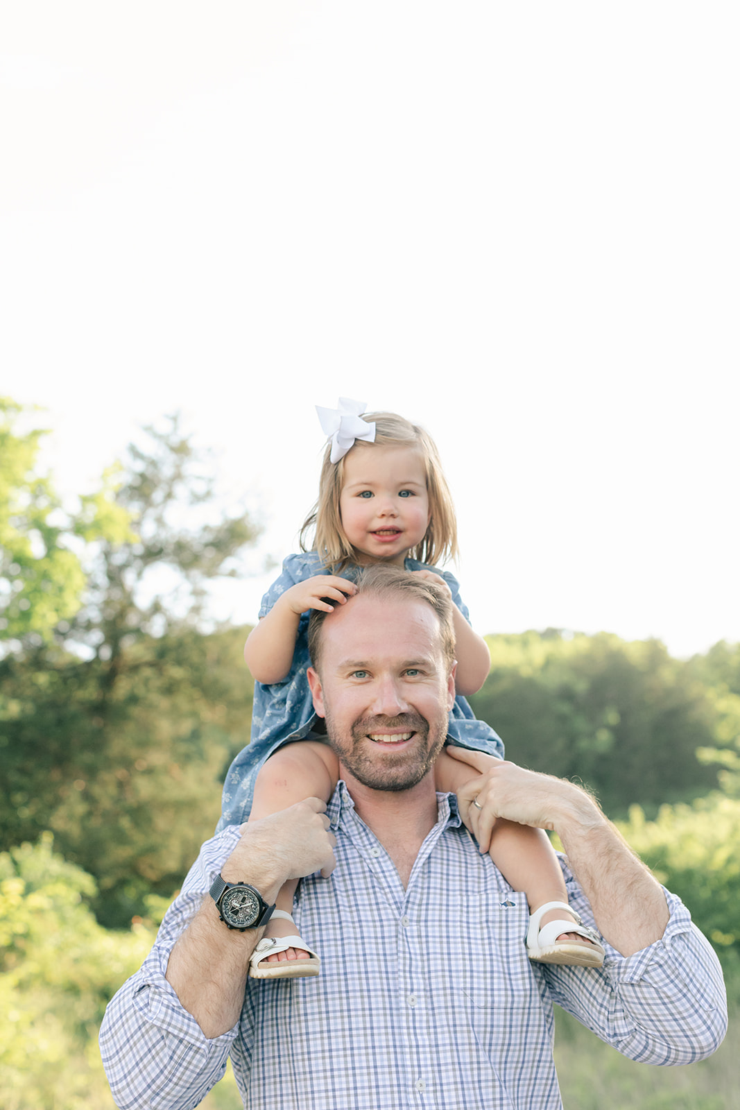 outdoor family photos for 2 year baby milestone session in nashville tennessee. photo of dad and daughter