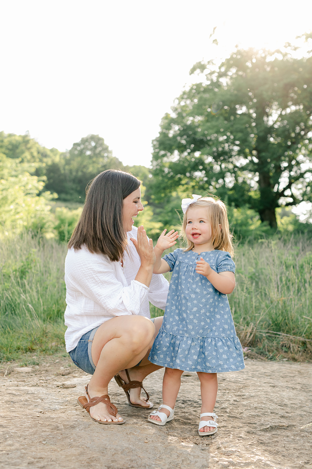 outdoor family photos for 2 year baby milestone session in nashville tennessee. photo of mom and daughter