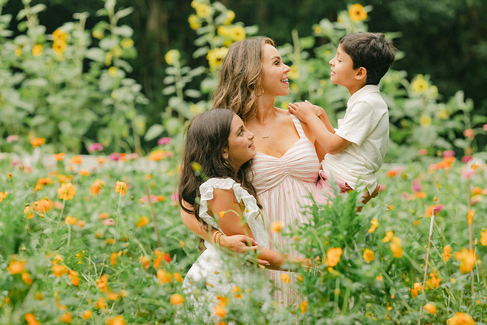 outdoor motherhood minis in garden. photographed in nashville photographer. mom with two kids