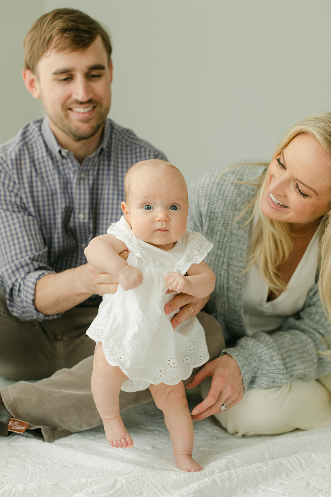 baby Charolette's 3 month milestone session in Nashville, Tennessee. photo of dad, mom and baby girl