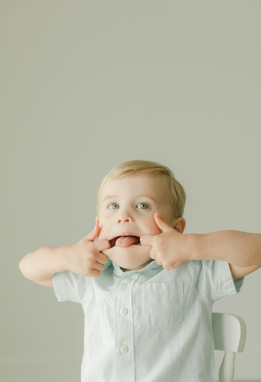 Bode's childhood portrait session in Nashville, Tennessee. Little boy making silly faces
