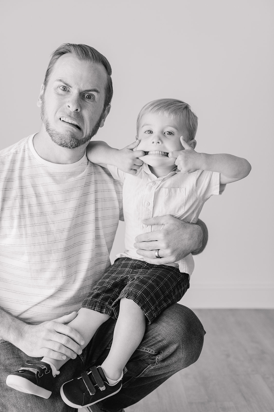 Bode's childhood portrait session in Nashville, Tennessee. Photo of dad and son making silly faces.