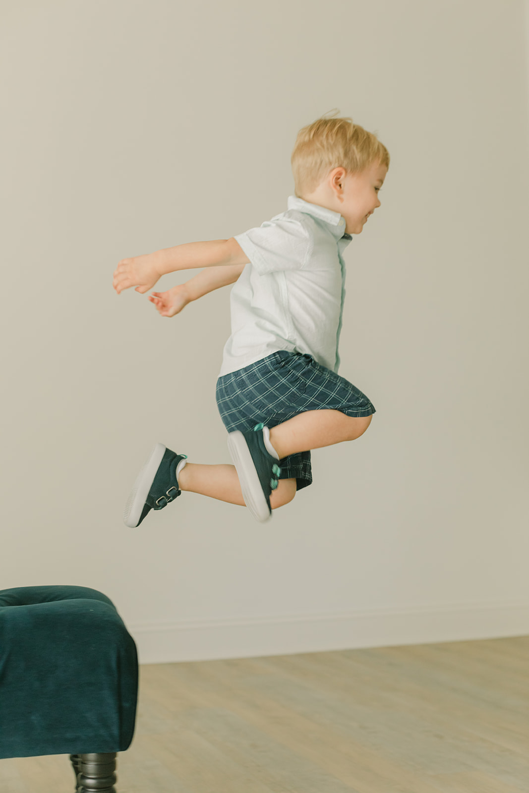 Bode's childhood portrait session in Nashville, Tennessee. Little boy jumping