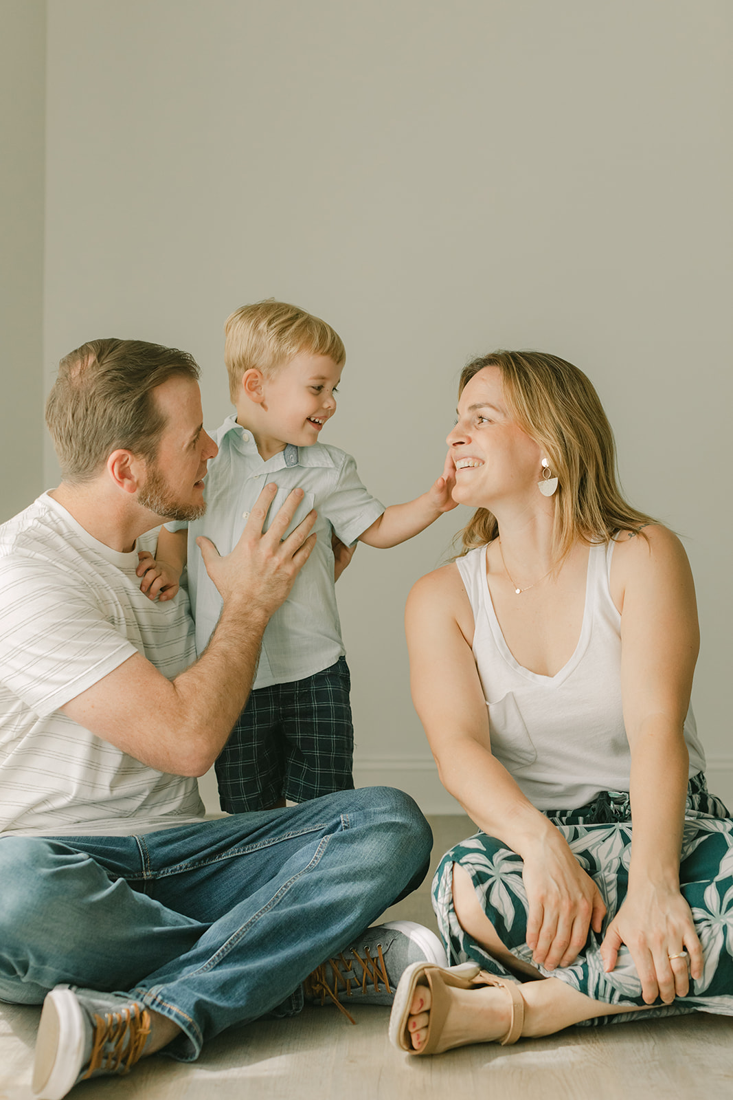 Bode's childhood portrait session in Nashville, Tennessee. Photo of family of three, mom, dad and baby boy