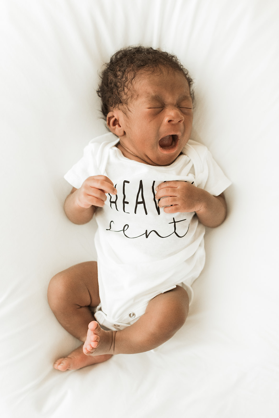 nashville newborn studio photo session. Yawning baby boy