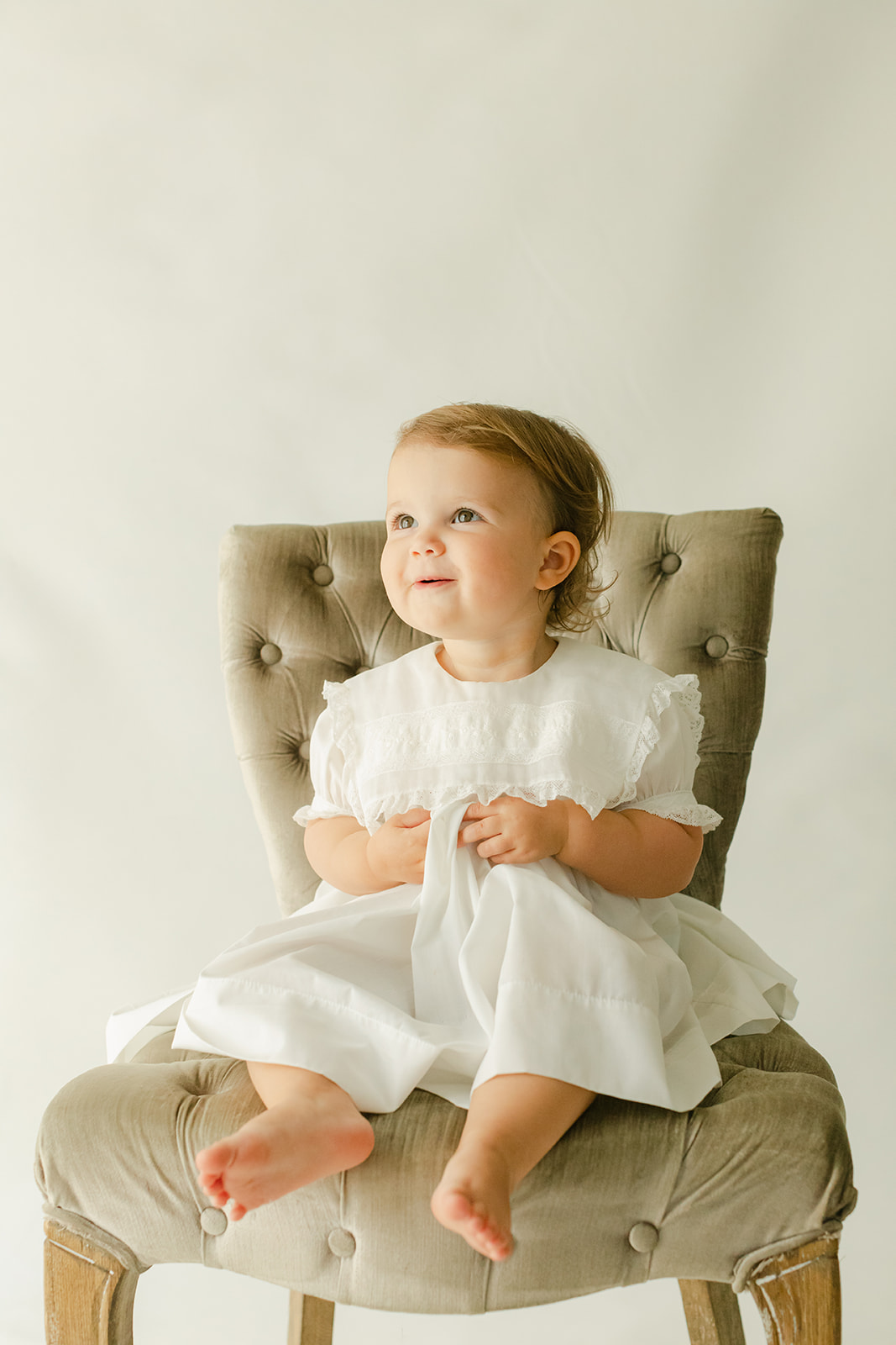 baby girl sitting in chair. four generational session in nashville tennessee